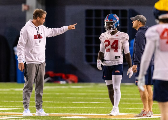 Ole Miss head coach Lane Kiffin (left) at practice with running back Ulysses Bentley IV.